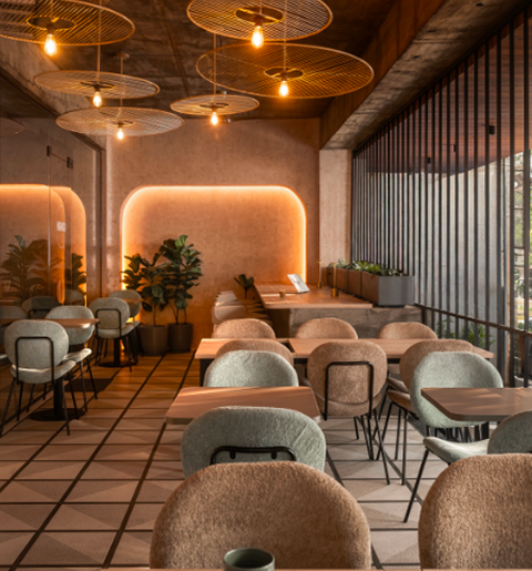 Warm-toned interior with layered materials, soft lighting, and contemporary furnishings