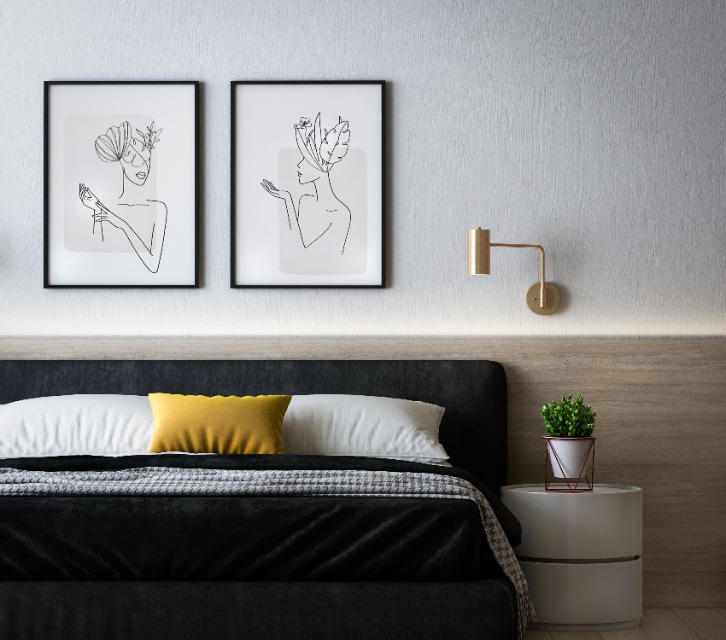 Minimal bedroom with artwork, wood accents, and warm accent lighting